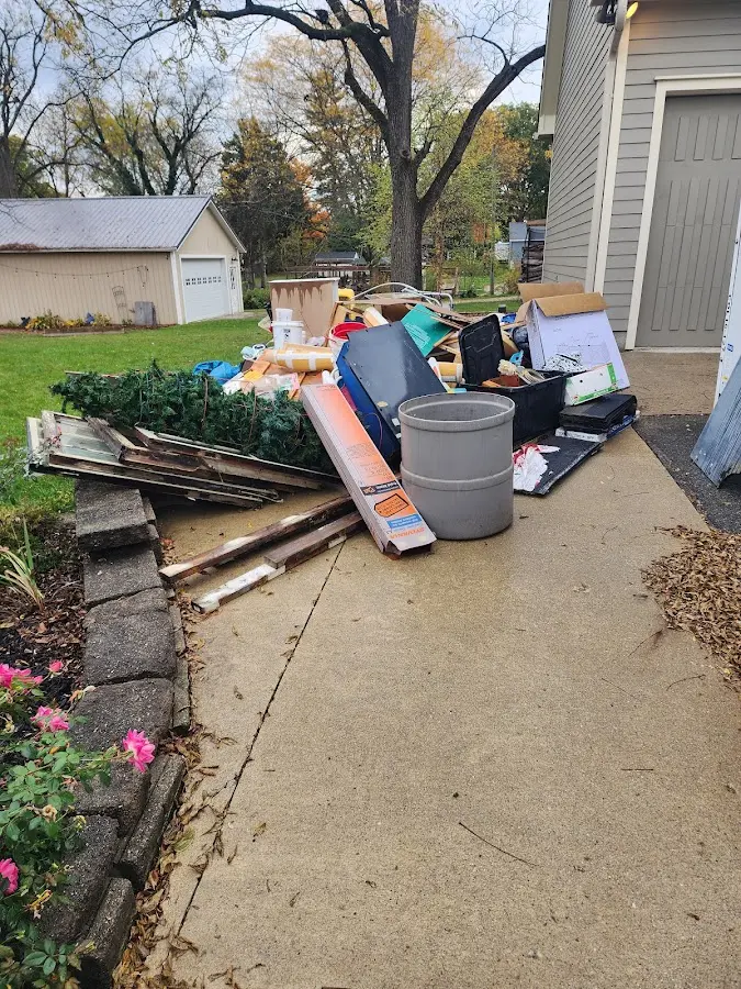 Dumpster being loaded with debris for Commercial Dumpster Rental in Stayton